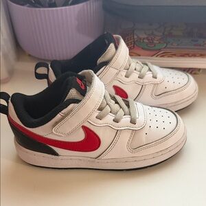 Nike Kids White Sneakers with Red Swoosh and Black Details